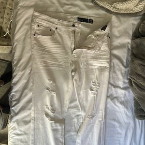 White pair of jeans that are are slim fit WXYZ’s size 34, link 32